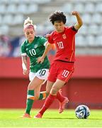 22 February 2023; Zhang Rui of China PR in action against Denise O'Sullivan of Republic of Ireland during the international friendly match between China PR and Republic of Ireland at Estadio Nuevo Mirador in Algeciras, Spain. Photo by Stephen McCarthy/Sportsfile