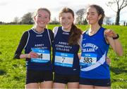 24 February 2023; Eve Dunphy, centre, from Abbey Community College Waterford with second place Charlotte Carpendale also from Abbey Community College and third place Sandra Vadell Farrus from St. Flannan's College, Ennis, Co Clare after the Intermediate Girls race during the 123.ie Munster Schools Cross Country Championships at SETU Waterford in Waterford. Photo by Matt Browne/Sportsfile