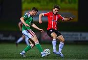 24 February 2023; Darragh Crowley of Cork City in action against Ollie O'Neill of Derry City during the SSE Airtricity Men's Premier Division match between Derry City and Cork City at The Ryan McBride Brandywell Stadium in Derry. Photo by Ben McShane/Sportsfile