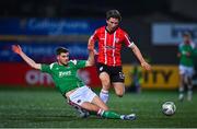 24 February 2023; Ollie O'Neill of Derry City is tackled by Darragh Crowley of Cork City during the SSE Airtricity Men's Premier Division match between Derry City and Cork City at The Ryan McBride Brandywell Stadium in Derry. Photo by Ben McShane/Sportsfile