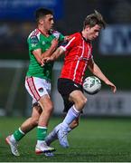 24 February 2023; Ollie O'Neill of Derry City in action against Barry Coffey of Cork City during the SSE Airtricity Men's Premier Division match between Derry City and Cork City at The Ryan McBride Brandywell Stadium in Derry. Photo by Ben McShane/Sportsfile