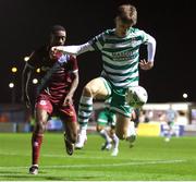 24 February 2023; Johnny Kenny of Shamrock Rovers in action against Emmanuel Adegboyega of Drogheda United during the SSE Airtricity Men's Premier Division match between Drogheda United and Shamrock Rovers at Weaver's Park in Drogheda, Louth. Photo by Michael P Ryan/Sportsfile