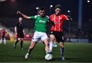 24 February 2023; Barry Coffey of Cork City in action against Ollie O'Neill of Derry City during the SSE Airtricity Men's Premier Division match between Derry City and Cork City at The Ryan McBride Brandywell Stadium in Derry. Photo by Ben McShane/Sportsfile