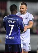 24 February 2023; Paddy Barrett of Shelbourne and Serge Atakayi of St Patrick's Athletic after the SSE Airtricity Men's Premier Division match between St Patrick's Athletic and Shelbourne at Richmond Park in Dublin. Photo by Tyler Miller/Sportsfile