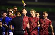 24 February 2023; David Hurley of Galway United, centre, receives a yellow card during the SSE Airtricity Men's First Division match between Galway United and Treaty United at Eamonn Deacy Park in Galway. Photo by John Sheridan/Sportsfile