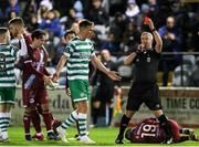 24 February 2023; Dan Cleary of Shamrock Rovers is shown a red card by referee Sean Grant during the SSE Airtricity Men's Premier Division match between Drogheda United and Shamrock Rovers at Weaver's Park in Drogheda, Louth. Photo by Michael P Ryan/Sportsfile