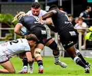 25 February 2023; Rory Sutherland of Ulster, supported by teammate Stewart Moore is tackled by Dylan Richardson, left and Ntuthuko Mchunu of Cell C Sharks during the United Rugby Championship match between Cell C Sharks and Ulster at HollywoodBets Kings Park in Durban, South Africa. Photo by Darren Stewart/Sportsfile