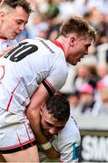 25 February 2023; Jake Flannery of Ulster helps teammate Aaron Sexton up during the United Rugby Championship match between Cell C Sharks and Ulster at HollywoodBets Kings Park in Durban, South Africa. Photo by Darren Stewart/Sportsfile