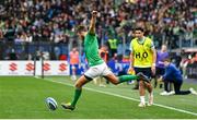 25 February 2023; Ross Byrne of Ireland kicks a conversion, watched by Ireland water boy Joey Carbery, during the Guinness Six Nations Rugby Championship match between Italy and Ireland at the Stadio Olimpico in Rome, Italy. Photo by Seb Daly/Sportsfile