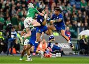 25 February 2023; Mack Hansen of Ireland contests a high ball against Juan Ignacio Brex, middle, and Pierre Bruno of Italy during the Guinness Six Nations Rugby Championship match between Italy and Ireland at the Stadio Olimpico in Rome, Italy. Photo by Ramsey Cardy/Sportsfile