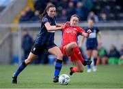 25 February 2023; Chloe Singleton of Athlone Town is tackled by Rachel Graham of Shelbourne during the FAI Women's President's Cup match between Athlone Town and Shelbourne at Athlone Town Stadium in Athlone, Westmeath. Photo by Stephen McCarthy/Sportsfile