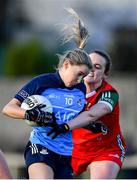 25 February 2023; Caoimhe O'Connor of Dublin in action against Fiona McHale of Mayo during the 2023 Lidl Ladies National Football League Division 1 Round 5 match between Dublin and Mayo at DCU St Clare's in Dublin. Photo by Ray McManus/Sportsfile