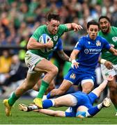 25 February 2023; Hugo Keenan of Ireland evades the tackle of Paolo Garbisi of Italy on his way to scoring his side's second try during the Guinness Six Nations Rugby Championship match between Italy and Ireland at the Stadio Olimpico in Rome, Italy. Photo by Ramsey Cardy/Sportsfile