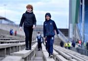 25 February 2023; Mayo supporters Jason Glavey, left, and Conor Cassidy, both age 12, both from Kilkelly, Mayo, make their way to their seats before the Allianz Football League Division 1 match between Mayo and Tyrone at Hastings Insurance MacHale Park in Castlebar, Mayo. Photo by Ben McShane/Sportsfile