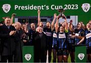 25 February 2023; Athlone Town captain Laurie Ryan lifts the FAI Women's President's Cup in the company of President of Ireland Michael D Higgins, FAI President Gerry McAnaney and Thomas Byrne T.D, Minister of State at the Department of Tourism, Culture, Arts, Gaeltacht, Sport and Media, after the FAI Women's President's Cup match between Athlone Town and Shelbourne at Athlone Town Stadium in Athlone, Westmeath. Photo by Stephen McCarthy/Sportsfile