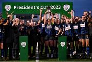 25 February 2023; Athlone Town captain Laurie Ryan lifts the FAI Women's President's Cup in the company of President of Ireland Michael D Higgins, FAI President Gerry McAnaney and Thomas Byrne T.D, Minister of State at the Department of Tourism, Culture, Arts, Gaeltacht, Sport and Media, after the FAI Women's President's Cup match between Athlone Town and Shelbourne at Athlone Town Stadium in Athlone, Westmeath. Photo by Stephen McCarthy/Sportsfile