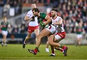 25 February 2023; Aidan O'Shea of Mayo is tackled by Padraig Hampsey of Tyrone during the Allianz Football League Division 1 match between Mayo and Tyrone at Hastings Insurance MacHale Park in Castlebar, Mayo. Photo by Ben McShane/Sportsfile
