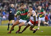 25 February 2023; Aidan O'Shea of Mayo is tackled by Padraig Hampsey of Tyrone during the Allianz Football League Division 1 match between Mayo and Tyrone at Hastings Insurance MacHale Park in Castlebar, Mayo. Photo by Ben McShane/Sportsfile