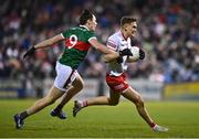 25 February 2023; Conn Kilpatrick of Tyrone is tackled by Diarmuid O'Connor of Mayo during the Allianz Football League Division 1 match between Mayo and Tyrone at Hastings Insurance MacHale Park in Castlebar, Mayo. Photo by Ben McShane/Sportsfile