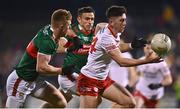 25 February 2023; Joe Oguz of Tyrone in action against David McBrien, left, and Jason Doherty of Mayo during the Allianz Football League Division 1 match between Mayo and Tyrone at Hastings Insurance MacHale Park in Castlebar, Mayo. Photo by Ben McShane/Sportsfile