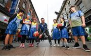 28 February 2023; Former Dublin Footballer Michael Darragh Macauley, centre, is pictured with children from Dublin’s new North East Inner City ‘Trojans’ Basketball Club, from left, Amirlan Bayanbat, Lorena Iacob, Xinni Chen, Andre Nonai, Louisa da Silva Lucas and Sophie Zhan, where he is a founding member, and the club are supported by locally headquartered insurer AIG. The partnership is part of AIG’s continued support for local communities by supporting the club and its members for the 2023 season through its Diversity, Equality, and Inclusion programme on Henry Street in Dublin. Photo by David Fitzgerald/Sportsfile