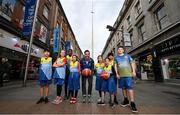 28 February 2023; Former Dublin Footballer Michael Darragh Macauley, centre, is pictured with children from Dublin’s new North East Inner City ‘Trojans’ Basketball Club, from left, Amirlan Bayanbat, Lorena Iacob, Xinni Chen, Andre Nonai, Louisa da Silva Lucas and Sophie Zhan, where he is a founding member, and the club are supported by locally headquartered insurer AIG. The partnership is part of AIG’s continued support for local communities by supporting the club and its members for the 2023 season through its Diversity, Equality, and Inclusion programme on Henry Street in Dublin. Photo by David Fitzgerald/Sportsfile