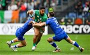 25 February 2023; Bundee Aki of Ireland is tackled by Tommaso Menoncello, left, and Edoardo Padovani of Italy during the Guinness Six Nations Rugby Championship match between Italy and Ireland at the Stadio Olimpico in Rome, Italy. Photo by Seb Daly/Sportsfile