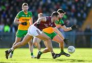 26 February 2023; John Maher of Galway in action against Caolan McColgan of Donegal during the Allianz Football League Division 1 match between Donegal and Galway at O'Donnell Park in Letterkenny, Donegal. Photo by Ben McShane/Sportsfile