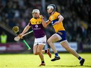 26 February 2023; Cathal Dunbar of Wexford is tackled by Diarmuid Ryan of Clare during the Allianz Hurling League Division 1 Group A match between Wexford and Clare at Chadwicks Wexford Park in Wexford. Photo by Ray McManus/Sportsfile