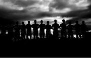 26 February 2023; (EDITOR'S NOTE; Image has been converted to black & white) Kildare players stand for Amhrán na bhFiann before the Allianz Football League Division 2 match between Kildare and Derry at St Conleth's Park in Newbridge, Kildare. Photo by Piaras Ó Mídheach/Sportsfile