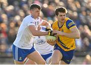 26 February 2023; Keith Doyle of Roscommon is tackled by Thomas McPhillips of Monaghan during the Allianz Football League Division 1 match between Monaghan and Roscommon at St Tiernach's Park in Clones, Monaghan. Photo by Ramsey Cardy/Sportsfile