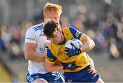 26 February 2023; Ben O'Carroll of Roscommon is tackled by Ryan O'Toole of Monaghan during the Allianz Football League Division 1 match between Monaghan and Roscommon at St Tiernach's Park in Clones, Monaghan. Photo by Ramsey Cardy/Sportsfile