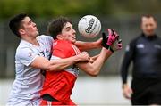 26 February 2023; Paul Cassidy of Derry is tackled by Mick O'Grady of Kildare during the Allianz Football League Division 2 match between Kildare and Derry at St Conleth's Park in Newbridge, Kildare. Photo by Piaras Ó Mídheach/Sportsfile