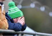 26 February 2023; A Naas RFC supporter nervously watches on during the Bank of Ireland Leinster Rugby Provincial Towns Cup Second Round match between Naas RFC and Newbridge RFC at Naas RFC in Naas, Kildare. Photo by Tyler Miller/Sportsfile