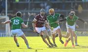26 February 2023; Conor Cooney of Galway in action against Limerick players, from left, Peter Casey, 15, Tom Morrissey and Gearoid Hegarty during the Allianz Hurling League Division 1 Group A match between Galway and Limerick at Pearse Stadium in Galway. Photo by Seb Daly/Sportsfile