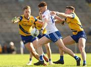 26 February 2023; Sean Jones of Monaghan shoots under pressure from Niall Daly, left, and Daire Cregg of Roscommon during the Allianz Football League Division 1 match between Monaghan and Roscommon at St Tiernach's Park in Clones, Monaghan. Photo by Ramsey Cardy/Sportsfile