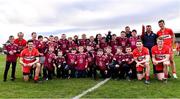 26 February 2023; Derry footballers Padraig Cassidy, 7, Chrissy McKaigue, 2, Paul McNeill, 17, Brendan Rogers, 9, and Shane McGuigan, 14, with members of their club Slaughtneil after the Allianz Football League Division 2 match between Kildare and Derry at St Conleth's Park in Newbridge, Kildare. Photo by Piaras Ó Mídheach/Sportsfile