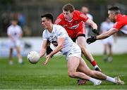 26 February 2023; Mick O'Grady of Kildare in action against Brendan Rogers and Niall Toner, right, of Derry during the Allianz Football League Division 2 match between Kildare and Derry at St Conleth's Park in Newbridge, Kildare. Photo by Piaras Ó Mídheach/Sportsfile