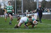 26 February 2023; Colm Stapleton of Naas RFC dives over to score his side's sixth try despite the efforts of Stephen Cooke of Newbridge RFC during the Bank of Ireland Leinster Rugby Provincial Towns Cup Second Round match between Naas RFC and Newbridge RFC at Naas RFC in Naas, Kildare. Photo by Tyler Miller/Sportsfile