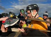 26 February 2023; Tony Kelly of Clare signs autographs on hurley sticks, programmes and a shoe, for supporters after the Allianz Hurling League Division 1 Group A match between Wexford and Clare at Chadwicks Wexford Park in Wexford. Photo by Ray McManus/Sportsfile
