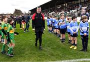 26 February 2023; Derry manager Rory Gallagher makes his way to the dressing room, past children from the Ballymore Eustace and Allenwood GAA clubs, before the Allianz Football League Division 2 match between Kildare and Derry at St Conleth's Park in Newbridge, Kildare. Photo by Piaras Ó Mídheach/Sportsfile