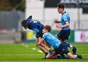 28 February 2023; Brian Caffery of Castleknock College is tackled by Josh Divilly of St Michael's College during the Bank of Ireland Leinster Schools Junior Cup Quarter Final match between Castleknock College and St Michael’s College at Energia Park in Dublin. Photo by Ben McShane/Sportsfile