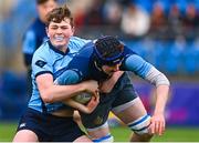 28 February 2023; Ben O'Toole of Castleknock College is tackled by Joe Kennedy of St Michael's College during the Bank of Ireland Leinster Schools Junior Cup Quarter Final match between Castleknock College and St Michael’s College at Energia Park in Dublin. Photo by Ben McShane/Sportsfile