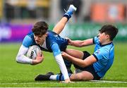 28 February 2023; Cory O'Connor of Castleknock College is tackled by Scott Barron of St Michael's College during the Bank of Ireland Leinster Schools Junior Cup Quarter Final match between Castleknock College and St Michael’s College at Energia Park in Dublin. Photo by Ben McShane/Sportsfile
