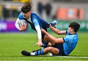 28 February 2023; Cory O'Connor of Castleknock College is tackled by Scott Barron of St Michael's College during the Bank of Ireland Leinster Schools Junior Cup Quarter Final match between Castleknock College and St Michael’s College at Energia Park in Dublin. Photo by Ben McShane/Sportsfile