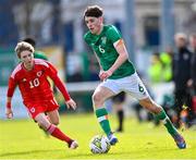 1 March 2023; Rory Finneran of Republic of Ireland in action against Hayden Allmark of Wales during the U15 international friendly match between Republic of Ireland and Wales at the Carlisle Grounds in Bray. Photo by Piaras Ó Mídheach/Sportsfile