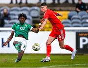 1 March 2023; Jaden Umeh of Republic of Ireland scores his side's second goal, under pressure from Bobo Evans of Wales, during the U15 international friendly match between Republic of Ireland and Wales at the Carlisle Grounds in Bray. Photo by Piaras Ó Mídheach/Sportsfile