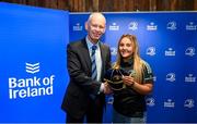 1 March 2023; Aoife Dalton is presented with her first cap by incoming Leinster Rugby president Billy Murphy during the Leinster Rugby Women's Cap and Jersey presentation at the Bank of Ireland Montrose Branch in Dublin. Photo by Harry Murphy/Sportsfile