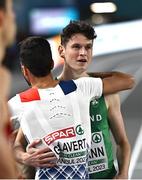 2 March 2023; Luke McCann of Ireland, right, is embraced by Louis Gilavert of France after qualifying for the men's 1500m final during Day 0 of the European Indoor Athletics Championships at Ataköy Athletics Arena in Istanbul, Türkiye. Photo by Sam Barnes/Sportsfile