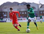 1 March 2023; Ade Solanke of Republic of Ireland in action against Kai Rhodes of Wales during the U15 international friendly match between Republic of Ireland and Wales at the Carlisle Grounds in Bray. Photo by Piaras Ó Mídheach/Sportsfile